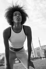 Image showing Portrait of sporty young african american woman running outdoors