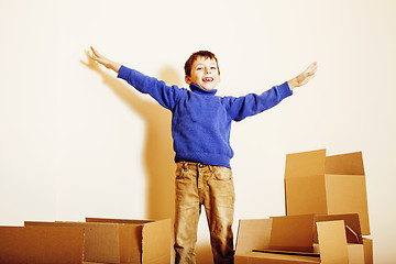 Image showing little cute boy in empty room, remoove to new house. home alone, lifestyle people concept