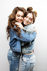 Image showing lifestyle and people concept: Fashion portrait of two stylish sexy girls best friends, over white background. Happy time for fun.