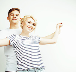 Image showing young pretty teenage couple, hipster guy with his girlfriend happy smiling and hugging isolated on white background, lifestyle people concept