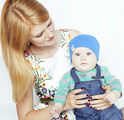 Image showing young beauty mother with cute baby, red head happy modern family isolated on white background close up, lifestyle people concept