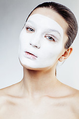 Image showing young pretty woman with facial white mask isolated close up spa, lifestyle people healthcare concept