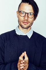 Image showing handsome middle age hipster man with modern hairstyle and tattoo, beard, close up on white background