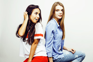 Image showing best friends teenage girls together having fun, posing emotional on white background, besties happy smiling, lifestyle people concept, blond and brunette multi nations