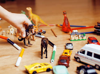Image showing children playing toys on floor at home, little hand in mess, free education
