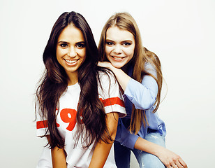 Image showing best friends teenage girls together having fun, posing emotional on white background, besties happy smiling, lifestyle people concept, blond and brunette multi nations