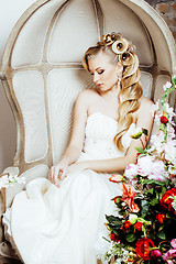 Image showing beauty young bride alone in luxury vintage interior with a lot of flowers close up