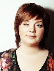 Image showing mature fat cheerful smiling woman close up isolated in studio