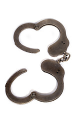 Image showing steel handcuffs. isolated on a white background.