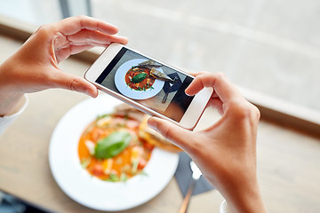 Image showing hands with smartphone photographing food