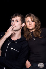 Image showing The young couple. Isolated on a black background