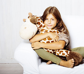 Image showing little cute brunette girl at home interior happy smiling close u