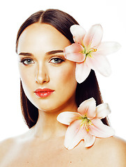 Image showing young attractive lady close up with hands on face isolated flowe