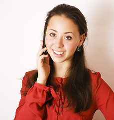 Image showing young pretty brunette woman smiling happy on white background, l