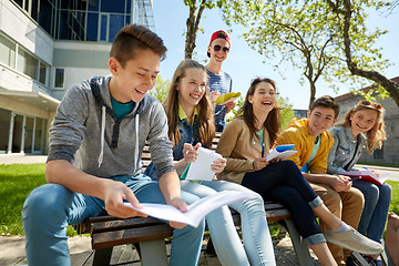 Image showing group of students with notebooks at school yard