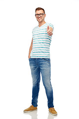 Image showing young smiling man in eyeglasses showing thumbs up