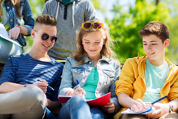 Image showing group of students with notebooks at school yard