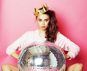 Image showing young cute disco girl on pink background with disco ball and cro