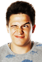 Image showing young handsome brunete man emotional posing on white background 