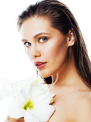 Image showing young pretty woman with  Amarilis flower close up isolated on wh