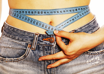 Image showing girls stomach measuring with tape twice isolated