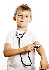 Image showing little cute boy with stethoscope playing like adult profession d