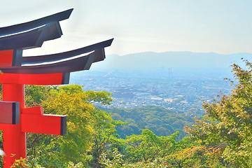 Image showing Kyoto cityscape from Inariyama mountain with a red torii gate.