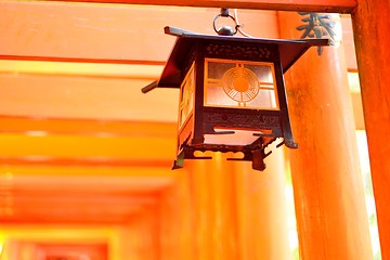 Image showing Lantern and red torii gates at Fushimi Inari