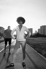 Image showing Portrait of sporty young african american woman running outdoors