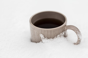 Image showing tea or coffee mug in snow