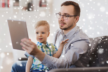 Image showing father and son with tablet pc playing at home