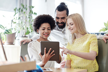 Image showing happy creative team with tablet pc in office