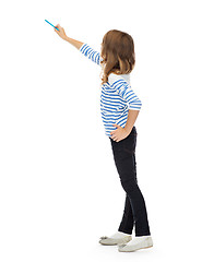Image showing girl pointing marker at something invisible