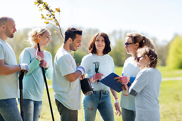 Image showing group of volunteers planting trees in park