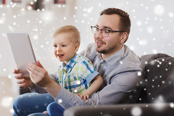 Image showing father and son with tablet pc playing at home