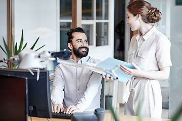 Image showing business team with computer and files in office