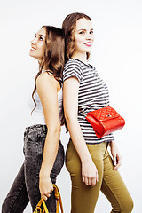 Image showing two best friends teenage girls together having fun, posing emotional on white background, besties happy smiling, lifestyle people concept