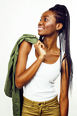 Image showing young pretty african-american girl posing cheerful emotional on white background isolated, lifestyle people concept
