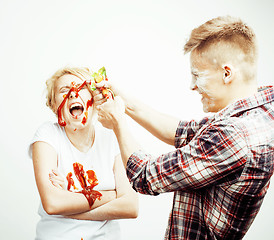 Image showing young pretty couple, lifestyle people concept: girlfriend and boyfriend cooking together, having fun, making mess isolated on white background