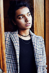 Image showing young pretty student teenage indian girl in doors happy smiling,