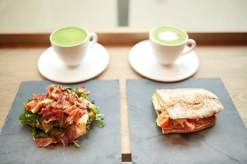 Image showing salad, sandwich and matcha green tea at restaurant