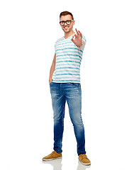 Image showing young man in eyeglasses showing ok hand sign