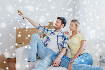 Image showing couple with boxes moving to new home and dreaming