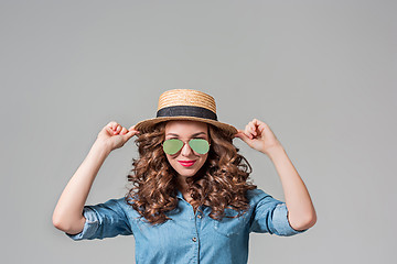 Image showing girl in sunglasses and straw