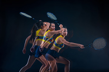 Image showing Portrait of beautiful girl tennis player with a racket on dark background