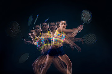 Image showing Portrait of beautiful girl tennis player with a racket on dark background