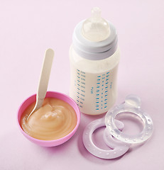 Image showing baby milk bottle and pureed apple