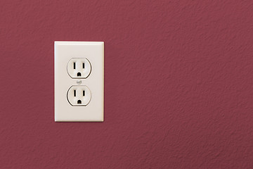 Image showing Electrical Sockets In Colorful Burgundy Wall