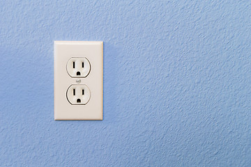 Image showing Electrical Sockets In Colorful Blue Wall