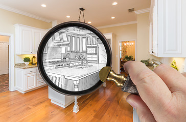 Image showing Hand Holding Magnifying Glass Revealing Custom Kitchen Design Dr